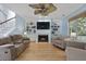 Bright living room featuring a fireplace, built-in shelves, and comfortable seating at 3525 E Higgins Dr, Mount Pleasant, SC 29466