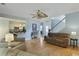 Open-concept living room with hardwood floors, comfortable seating, and views into the kitchen at 3525 E Higgins Dr, Mount Pleasant, SC 29466