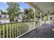 Inviting front porch with hanging flower baskets and views of neighboring homes at 3525 E Higgins Dr, Mount Pleasant, SC 29466