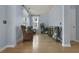 Inviting room featuring light blue walls, hardwood floors, plants and wicker chairs at 3525 E Higgins Dr, Mount Pleasant, SC 29466