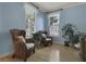 Inviting room featuring light blue walls, hardwood floors, plants and wicker chairs at 3525 E Higgins Dr, Mount Pleasant, SC 29466