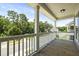 Relaxing balcony showcasing natural views, wood decking and white railing is perfect for enjoying the outdoors at 3705 Sandy Gate Ln, Mount Pleasant, SC 29466