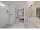 Bright bathroom features a glass shower, double vanity, and a neutral color palette at 3705 Sandy Gate Ln, Mount Pleasant, SC 29466