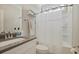 Bright bathroom featuring a shower with a shower curtain, toilet, sink, and grey counter at 3705 Sandy Gate Ln, Mount Pleasant, SC 29466