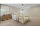 Neutral primary bedroom with bed, loveseat, dresser, windows, and ceiling fan at 3705 Sandy Gate Ln, Mount Pleasant, SC 29466