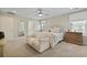 Neutral primary bedroom with bed, loveseat, dresser, ceiling fan, and window at 3705 Sandy Gate Ln, Mount Pleasant, SC 29466