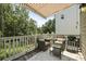 Outdoor deck with seating, awning, and views of the surrounding greenery at 3705 Sandy Gate Ln, Mount Pleasant, SC 29466