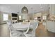 An open-concept dining room, kitchen, and living room area with wood-look floors at 3705 Sandy Gate Ln, Mount Pleasant, SC 29466