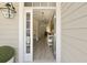 Welcoming foyer with hardwood floors and natural light featuring a decorative wreath and open view of the living area at 3705 Sandy Gate Ln, Mount Pleasant, SC 29466