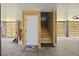Garage with door, plywood walls, concrete flooring, and overhead lighting at 3705 Sandy Gate Ln, Mount Pleasant, SC 29466