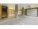Spacious unfinished garage with concrete flooring and garage door access at 3705 Sandy Gate Ln, Mount Pleasant, SC 29466