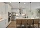 Spacious kitchen features an island with seating, stainless appliances, and modern lighting at 3705 Sandy Gate Ln, Mount Pleasant, SC 29466