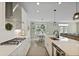 Open concept kitchen with white cabinets, an island, and views of the dining and living area at 3705 Sandy Gate Ln, Mount Pleasant, SC 29466