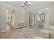 Bright living room with hardwood floors, decorative lighting, ample seating and natural light for an inviting atmosphere at 3705 Sandy Gate Ln, Mount Pleasant, SC 29466