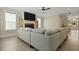 Spacious living room with a fireplace and a TV, alongside large windows at 3705 Sandy Gate Ln, Mount Pleasant, SC 29466