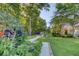 Expansive backyard featuring a beautiful garden, lush lawn, and a charming pergola for outdoor relaxation at 3751 St Ellens Dr, Mount Pleasant, SC 29466
