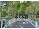 Expansive backyard with mature trees, a fountain, and lush landscaping offering a private and serene setting at 3751 St Ellens Dr, Mount Pleasant, SC 29466