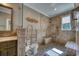 Accessible bathroom features tile shower with bench, and a vanity with granite countertops at 3751 St Ellens Dr, Mount Pleasant, SC 29466