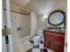 Cozy bathroom with a shower-tub combination and decorative round mirror over a vanity at 3751 St Ellens Dr, Mount Pleasant, SC 29466