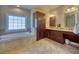 Spacious primary bath featuring a soaking tub, large window, and dual sink vanity at 3751 St Ellens Dr, Mount Pleasant, SC 29466