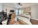 Cozy bedroom with wood floors, ceiling fan, TV, and decor; perfect for relaxation at 3751 St Ellens Dr, Mount Pleasant, SC 29466