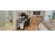 Functional bedroom with office setup, TV, and adjacent bathroom; ideal for work or rest at 3751 St Ellens Dr, Mount Pleasant, SC 29466