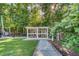 Backyard featuring a charming chicken coop, surrounded by lush greenery, offering a touch of rustic charm at 3751 St Ellens Dr, Mount Pleasant, SC 29466