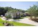 Beautiful home with a spacious driveway, manicured lawn, and a mix of brick and siding at 3751 St Ellens Dr, Mount Pleasant, SC 29466