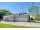 Lovely home featuring a two-car garage, well-maintained lawn, and a combination of siding and brick accents at 3751 St Ellens Dr, Mount Pleasant, SC 29466