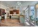 Bright, open kitchen boasts modern stainless steel appliances, granite countertops, and hardwood floors at 3751 St Ellens Dr, Mount Pleasant, SC 29466