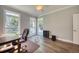 Well-lit office space with wood floors, neutral walls, and backyard views from multiple windows at 3751 St Ellens Dr, Mount Pleasant, SC 29466