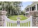 A charming backyard with manicured lawn and a decorative water feature, creating a serene outdoor space at 401 Ralston Creek St, Charleston, SC 29492