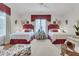 Charming bedroom featuring two twin beds, floral accents, and abundant natural light at 401 Ralston Creek St, Charleston, SC 29492