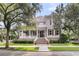 Beautiful two-story home featuring a grand entrance with brick steps and a well-manicured lawn at 401 Ralston Creek St, Charleston, SC 29492