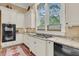 Well-appointed kitchen with sleek appliances, custom cabinetry, and bright natural light at 401 Ralston Creek St, Charleston, SC 29492