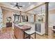 Gourmet kitchen featuring an island, stainless steel appliances, and a seamless flow to dining area at 401 Ralston Creek St, Charleston, SC 29492