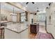 Open concept kitchen showcasing a large island, modern appliances, and custom cabinetry at 401 Ralston Creek St, Charleston, SC 29492