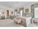 Bright main bedroom features comfortable seating and a beautiful floral motif at 401 Ralston Creek St, Charleston, SC 29492