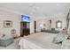 Large main bedroom with seating, desk, and doors showcasing the spacious and open design at 401 Ralston Creek St, Charleston, SC 29492
