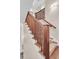 Elegant staircase with wood railing and runner, providing a seamless transition between floors at 401 Ralston Creek St, Charleston, SC 29492
