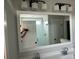 Stylish bathroom featuring a large mirror and modern lighting fixtures at 4126 O'Hear Ave, North Charleston, SC 29406