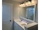 Bright bathroom with double vanity, large mirror and modern light fixtures at 4126 O'Hear Ave, North Charleston, SC 29406