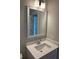 Modern bathroom features a framed mirror, new vanity, contemporary lighting, and GFCI electrical outlets at 4126 O'Hear Ave, North Charleston, SC 29406
