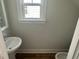 Bright half bathroom featuring a pedestal sink and natural light at 4126 O'Hear Ave, North Charleston, SC 29406