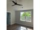 Spacious bedroom with a ceiling fan and large window overlooking the backyard at 4126 O'Hear Ave, North Charleston, SC 29406