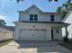 Beautiful two-story home featuring a large two-car garage and modern white facade at 4126 O'Hear Ave, North Charleston, SC 29406