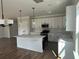 Bright, open kitchen featuring stainless appliances and stylish pendant lighting at 4126 O'Hear Ave, North Charleston, SC 29406
