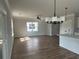 Open floorplan with natural light and hardwood floors leading to the kitchen at 4126 O'Hear Ave, North Charleston, SC 29406