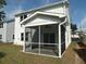 A screened in porch with a ceiling fan at 4126 O'Hear Ave, North Charleston, SC 29406