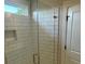 Modern shower featuring a glass door and white subway tile at 4126 O'Hear Ave, North Charleston, SC 29406